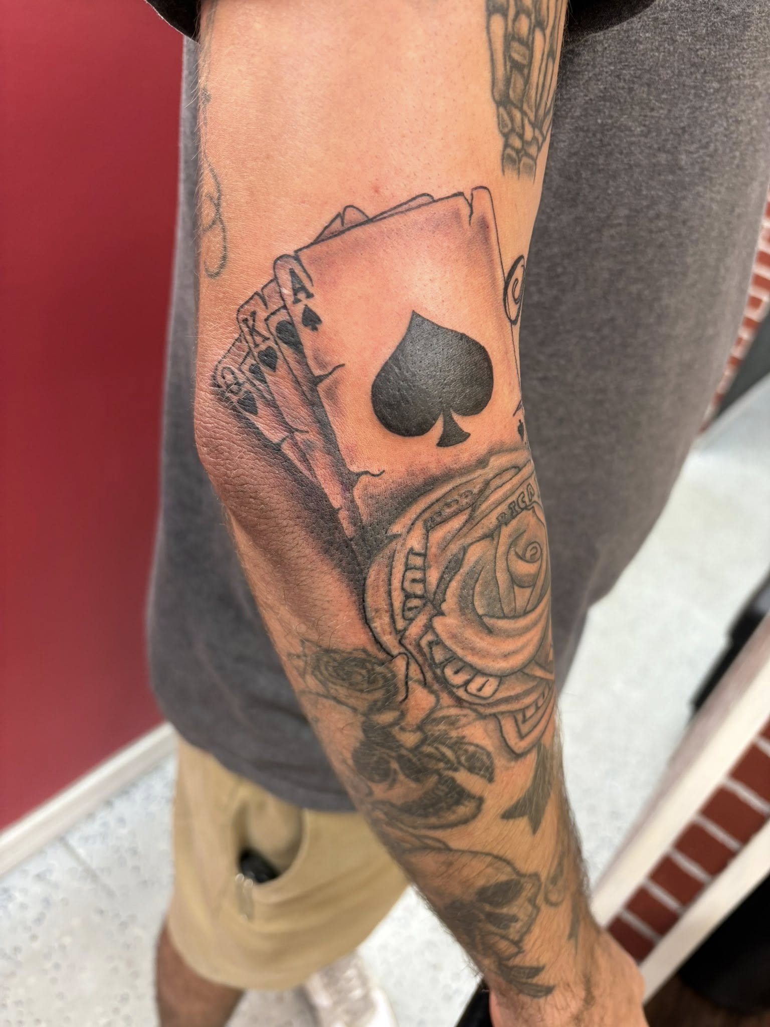 Playing cards with Ace of Spades and roses in black and grey