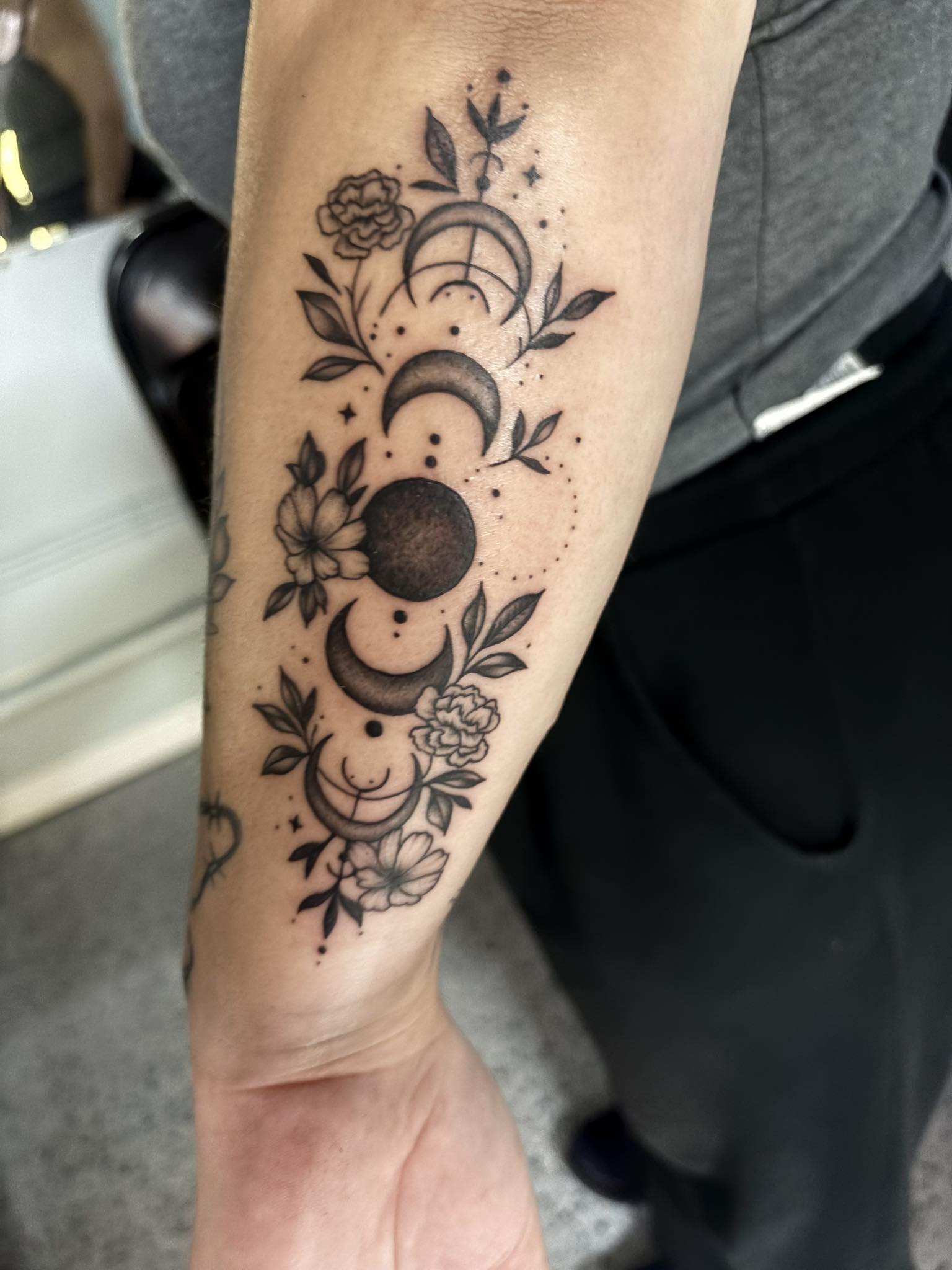 Moon phases with floral accents and botanical details